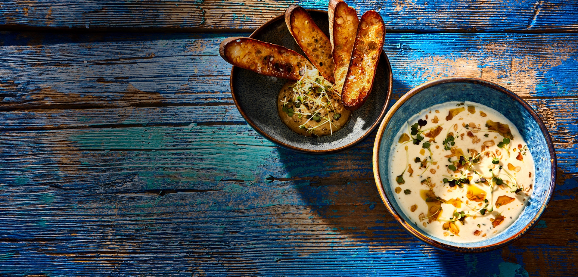 Header Potato-onion soup with porcini mushroom sauce and crostini